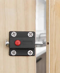 10 Pack Hella Sturdy Automatic Spring Latch Bolt For Cabinets Drawers And Doors Black installed on wood with red button.
