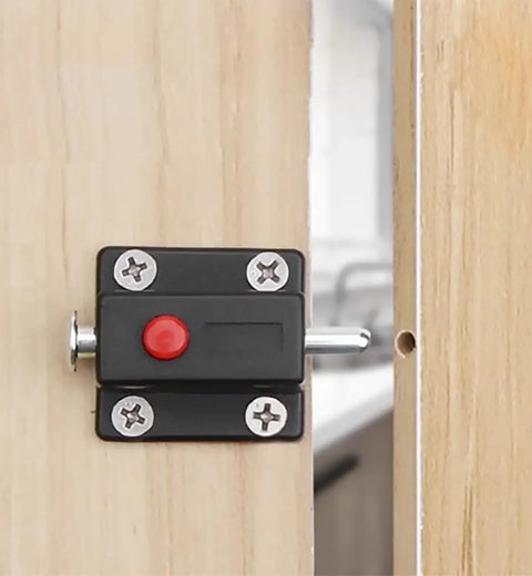 10 Pack Hella Sturdy Automatic Spring Latch Bolt For Cabinets Drawers And Doors Black installed on wood with red button.