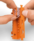 Go To Connection Terminal Set With 225 Pieces And 4 Mounting Adapters For All Conductor Types in hand showing quick clamp system.