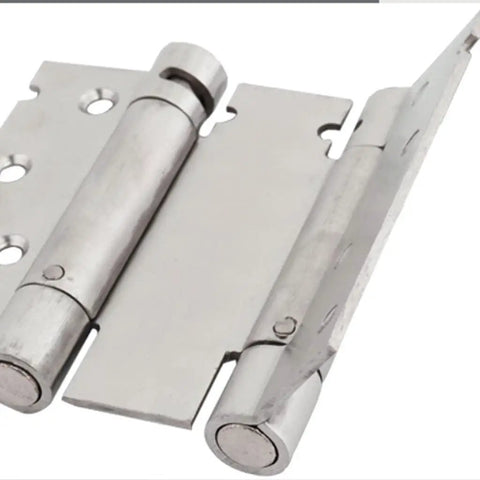 Close-up of Stainless Steel Spring Hinge For Two Way Doors With Free Entry And Exit Double Sided Indoor And Outdoor Opening.
