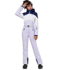 Model wearing women one piece ski suit for snowboarding and snowmobiling, waterproof and windproof jumpsuit with thermal insulation.
