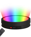 Motorized 360 Degree Rotating Display Stand With Remote Control And Seven Color Led Lights For Jewelry Photography And Collectibles Black 32 Cm Turntable showing rainbow LED lights and remote.