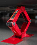 Heavy Duty Steel Scissor Lift Jack 1.5 Ton Car Kit lifting vehicle, compact and rugged for trunk storage.