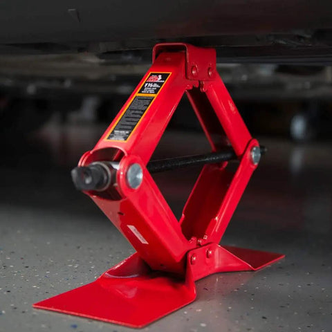 Heavy Duty Steel Scissor Lift Jack 1.5 Ton Car Kit lifting vehicle, compact and rugged for trunk storage.