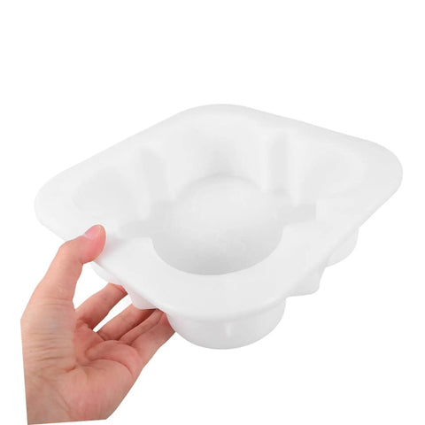 Person holding a white concrete paver mold for pathways and patios easy to use stepping stone molds for garden walkways borders driveways portable and versatile paving tool for DIY landscaping.