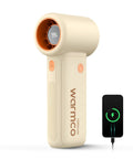 Beige 10000mAh Portable Handheld Fan With USB Rechargeable Power Dope Mini Turbo Breeze next to charging phone