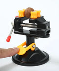Portable Aluminum Alloy Drill Press Vise With Suction Base, Table Bench Clamp For Jewelry Making And Hobby Crafts, Small Parts Holding, Mini Workbench Vise For Workshop, Lightweight Yet Rugged And Easy Mount. Black mini vise with suction base holding a small part