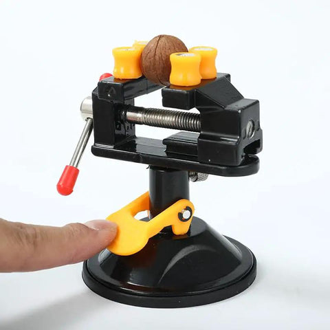 Portable Aluminum Alloy Drill Press Vise With Suction Base, Table Bench Clamp For Jewelry Making And Hobby Crafts, Small Parts Holding, Mini Workbench Vise For Workshop, Lightweight Yet Rugged And Easy Mount. Black mini vise with suction base holding a small part