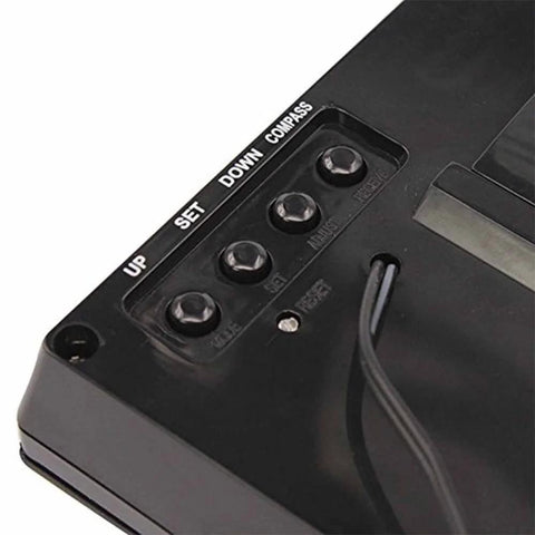 Back view of black digital kitchen clock with four round buttons labeled UP, SET, DOWN, COMPASS and a power cord