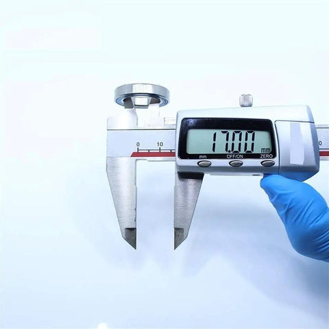 Measuring 6803RS Deep Groove Ball Bearing Set For Hobby Electric RC Cars And Trucks 17 mm with digital caliper.