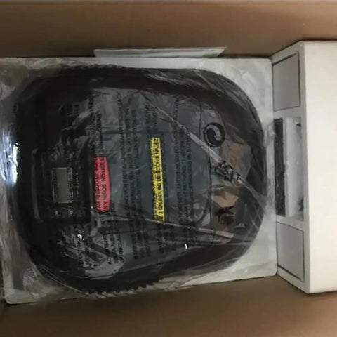 Autonomous Robotic Lawn Mower With Auto Charging, boxed for shipping; visible packaging and protective plastic covering device.