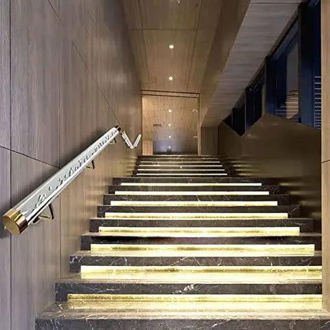 Clear Acrylic Stair Rail With Elegant Gold Brackets Adjustable Handrail Kit For Indoor Outdoor Rooms Slick Look Top Shelf Home Flex Easy Install Four Point Five Feet visible on modern staircase, showcasing gold mounts and transparent railing.