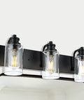 Three Head Vintage Bath Vanity Light Fixture In Matte Black With Clear Glass Shades Over Mirror Wall Mount Bathroom Lighting For Bright Welcoming Everyday Vibe