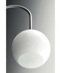 Close-up of glossy white globe on Carisa Three Light Chandelier In Brushed Nickel Finish With Glossy White Glass Globes For Modern Living And Dining Rooms Mid Century Revival Style For Home Decor