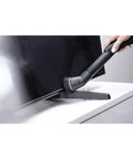 Using Attachable Dusting Brush For Vacuum Cleaners With Flexible Swivel Joint Pro Grade Furniture Care on TV stand surface