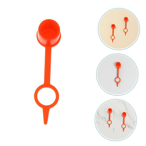 Close-up of 200Pcs Butter Mouth Cap Grease Extension Fitting Caps And Nozzles Kit, red plastic dust caps displayed on various backgrounds.