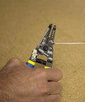 Klein Tools 11055EP wire cutter and stripper, close-up of hand cutting copper wire