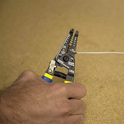Klein Tools 11055EP wire cutter and stripper, close-up of hand cutting copper wire