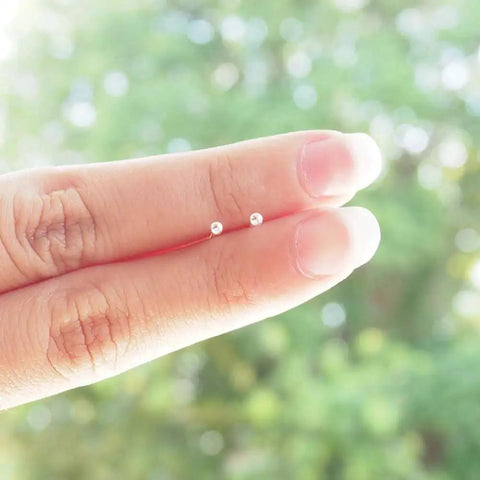 Sterling Silver Stud Earrings Unisex 3mm Small Round Ball Hypoallergenic Jewelry for Women and Men, Easy Everyday Wear, Low Key Minimalist Style, Durable Nickel Free Gift Idea, shown on fingers