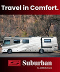 Side view of a white RV motorhome with Suburban brand logo and Travel in Comfort banner on a red background.