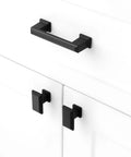 Installed 10 Pack 3 Inch Hole Center Matte Black Cabinet Pulls And Handles For Cabinets Drawers Dressers Vanities Closets Durable Metal Hardware With Included 1 Inch And 1 And A Half Inch Screws For Easy Installation on white cabinets.