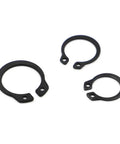 Grab These Heavy Duty M6 To M50 Shaft Circlips For Your Next DIY Fix They Are Made From Tough Carbon Steel To Keep Your Bearings Secure In Any Ride, three black carbon steel retaining rings.