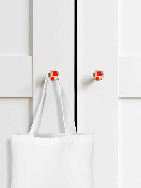 Gonna Level Up Your Cabinetry With These Knockout Beech Wood Cabinet Knobs Set Of Two 1.4 Inch Round Drawer Pulls Sporting Killer Red Painted Abstract Finish And Ridiculously Smooth Action on white cabinet with tote bag.