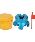 Front view of blue aluminum CNC lathe face mill head with four flutes; yellow protective cap and red hex key.