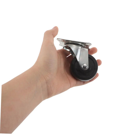 Four Pack Two Inch Rubber Swivel Caster Wheels Dead Silent Low Profile Design With Top Notch Nonslip Traction That Rolls Like A Dream For Office Carts And Workbenches Heavy Duty Replacement Rollers held in a hand.
