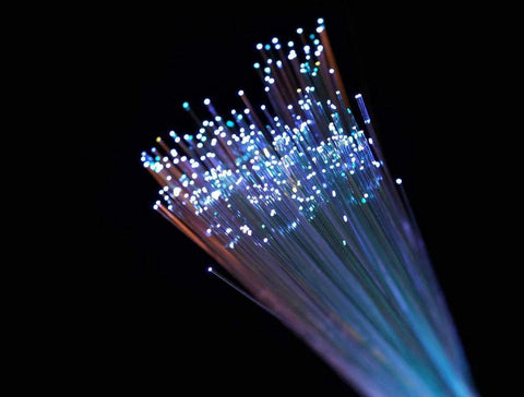 Close-up of AKEPO PMMA end-glow fiber optic light cable bundle; thin strands with multicolor glowing tips