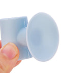 Person holding Silicone Suction Cup Door Stopper Wall Protector With Noise Reduction Pad for glass tile metal surfaces close-up