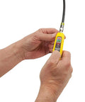 Person using Coax Explorer 2 VDV Cable Tester with Push Button Wire Tracing and Mapping, easy to read LED indicates Pass Open Short.