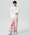 Model wearing Men's Waterproof Insulated Ski Pants With Baggy Snowboard Style Fit For Winter Outdoor Sports in pink
