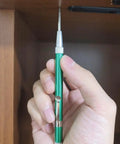 No Sweat Hammer Free Automatic Center Punch With Twist Dial Tension And Razor Sharp Carbide Tip Aluminum Body Pen Style in hand.