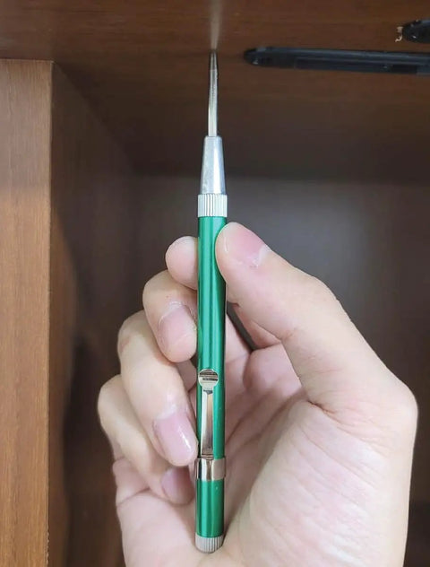 No Sweat Hammer Free Automatic Center Punch With Twist Dial Tension And Razor Sharp Carbide Tip Aluminum Body Pen Style in hand.