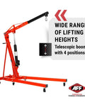 Rock Solid Two Ton Folding Engine Crane For Heavy Duty Garage Days with telescopic boom and swivel wheels for easy lifting.