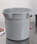 Heavy Duty 14 Quart Gray Round Pail For Pro Cleaning With Printed Measurement Lines And Solid Grip Bail on a stainless steel surface.