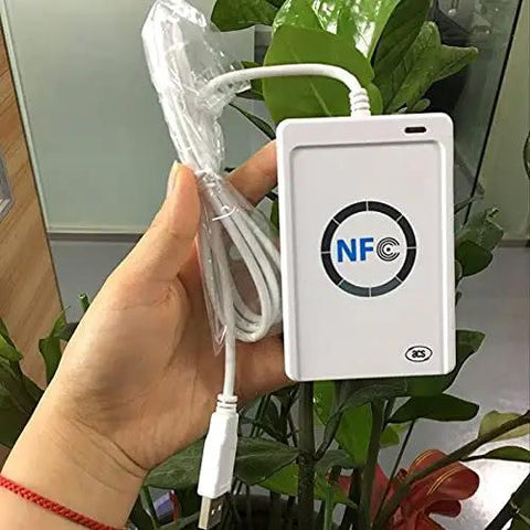 Hand holding ACR122u A9 Dope Reader Writer For Rewritable UID Changeable Cards with USB cable, NFC logo visible.