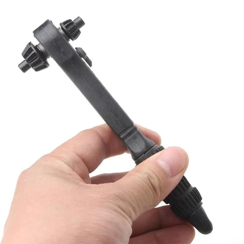 Versatile 2-In-1 Drill Chuck Key With Integrated Ratchet And 12.5Mm Square Drive Socket Wrench For Lightning Fast Bit Swaps and Effortless Forward Reverse Switching Without Breaking A Sweat Black Finish held in hand.