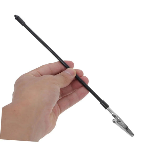 Hand holding flexible arm from Six Piece Flexible Soldering Alligator Clamps With Third Hand Tool And Magnifying Lamp for PCB work.