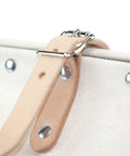 Close-up of leather buckle strap on Heavy Duty Natural Canvas Tool Bag Tote With Wide Hinged Opening And Leather Handles, 12 Inch Multi Purpose Tool Carrier, Rivet Reinforced Steel Frame, Moisture Resistant Vinyl Bottom, Non Scratch Feet, Built Tough