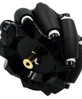 Omni wheel hub, black glossy plastic with brass axle insert and silver bearings.