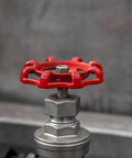 Close-up of red cast iron valve hand wheel for water fittings, part of 10 Pack Cast Iron Valve Hand Wheel Handles For Water Fittings
