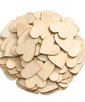 Pile of 100 natural unfinished two-inch wooden heart shapes for crafts, DIY wedding decor, Christmas party embellishments.