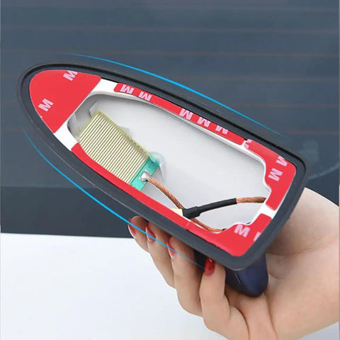 Hand holding Hyundai Veloster Shark Fin Antenna Cover For 2011 To 2018 Models, showing internal weatherproof components
