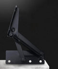 Black Heavy Duty Stainless Steel 80 Degree Foldable Lifting Brackets With Rock Solid Spring Action And Top Shelf Hardware Support For Cabinet Doors And Drawers Two Pack, side view on a surface.