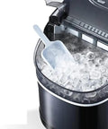 Portable Countertop Ice Maker Electric Machine with cylindrical ice cubes and scoop for drinks in compact design.
