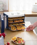 Digital Electric Food Dehydrator With Four Stackable Stainless Steel Trays And Precision Temperature Controls featuring dried fruit.