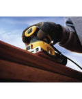 Beast Electric Sander 1/4 Sheet With 14,000 OPM And 2.3 Amp Motor in use on wood surface with rubber overmold handle.