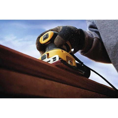 Beast Electric Sander 1/4 Sheet With 14,000 OPM And 2.3 Amp Motor in use on wood surface with rubber overmold handle.